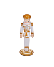 Inflatable nutcracker Christmas decor with gold and white details on a white background